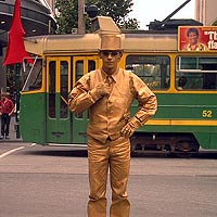 golden man and tram