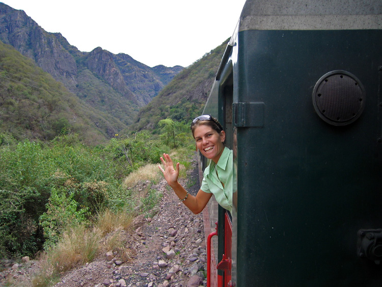 waving goodbye from a train  in Mexico